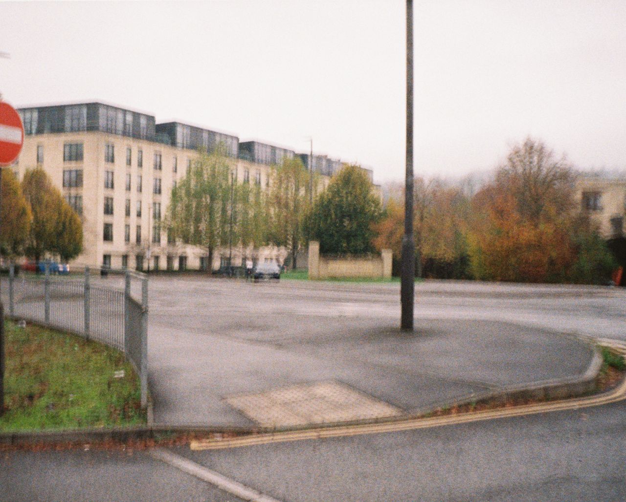 A photo of a building in the distance, taken on a Lomography Lomomatic 110 film camera