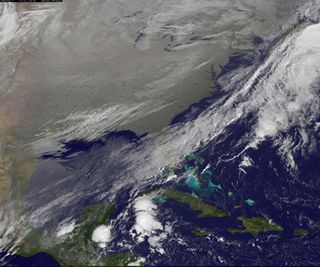 In this image, captured in infrared light by the National Oceanic and Atmospheric Agency's GOES-East satellite on Nov. 18, 2014, the cold air over the central and eastern U.S. looks like a gray-white blanket.