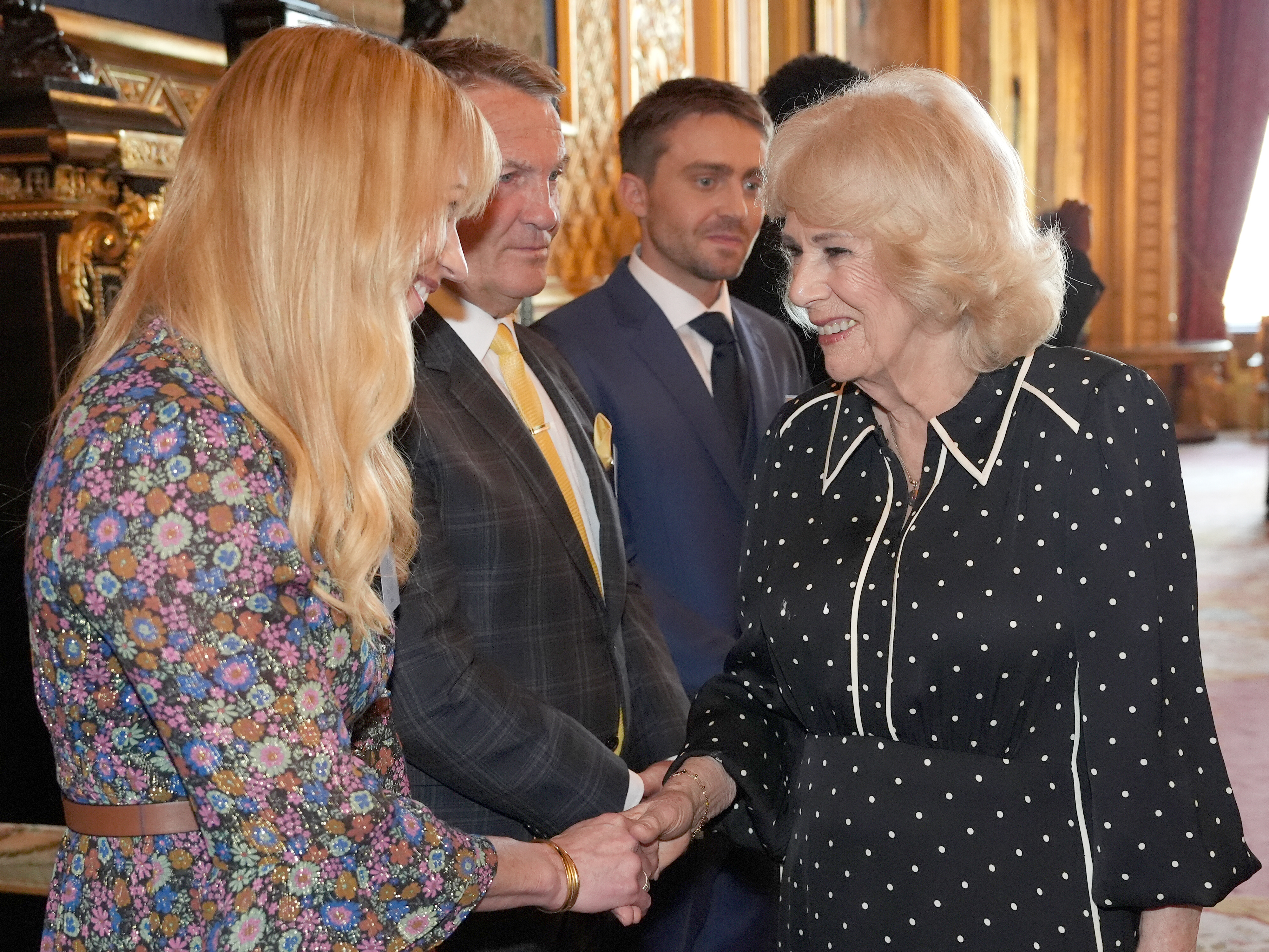 Queen Camilla speaks to Sara Cox during a reception with finalists, judges and celebrity readers, to celebrate the final of BBC's creative writing competition 500 Words at Windsor Castle on February 25, 2026