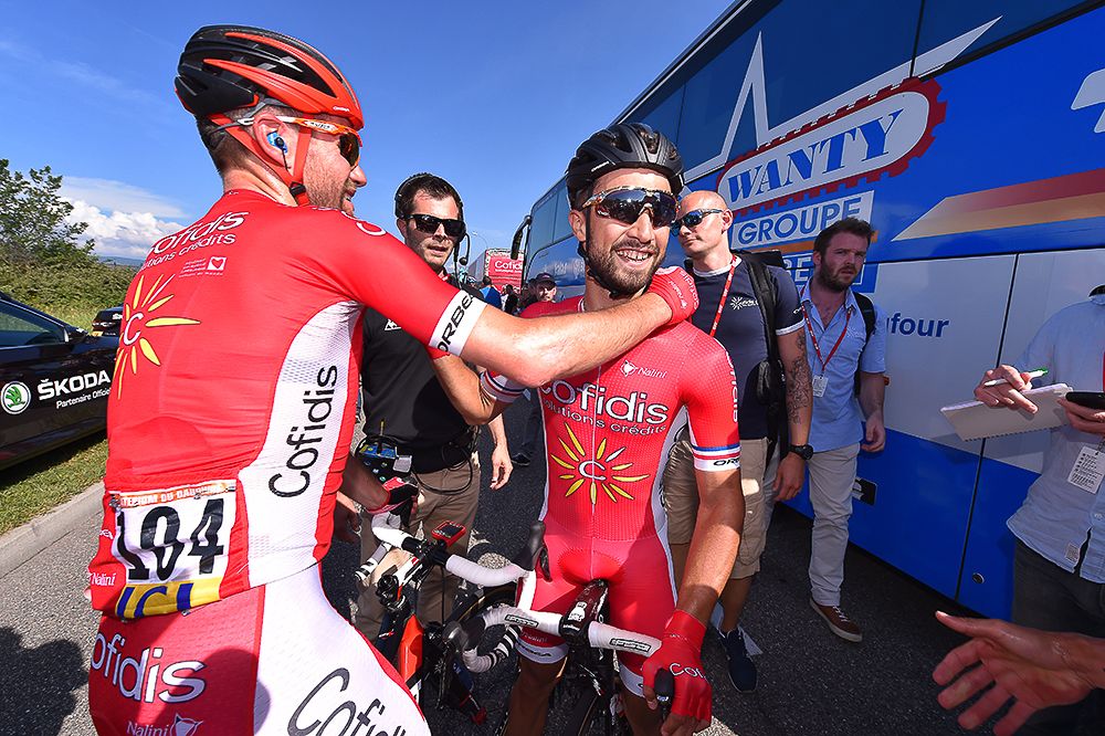 Teammates congratulate Nacer Bouhanni after e won stage 1 at Dauphine.
