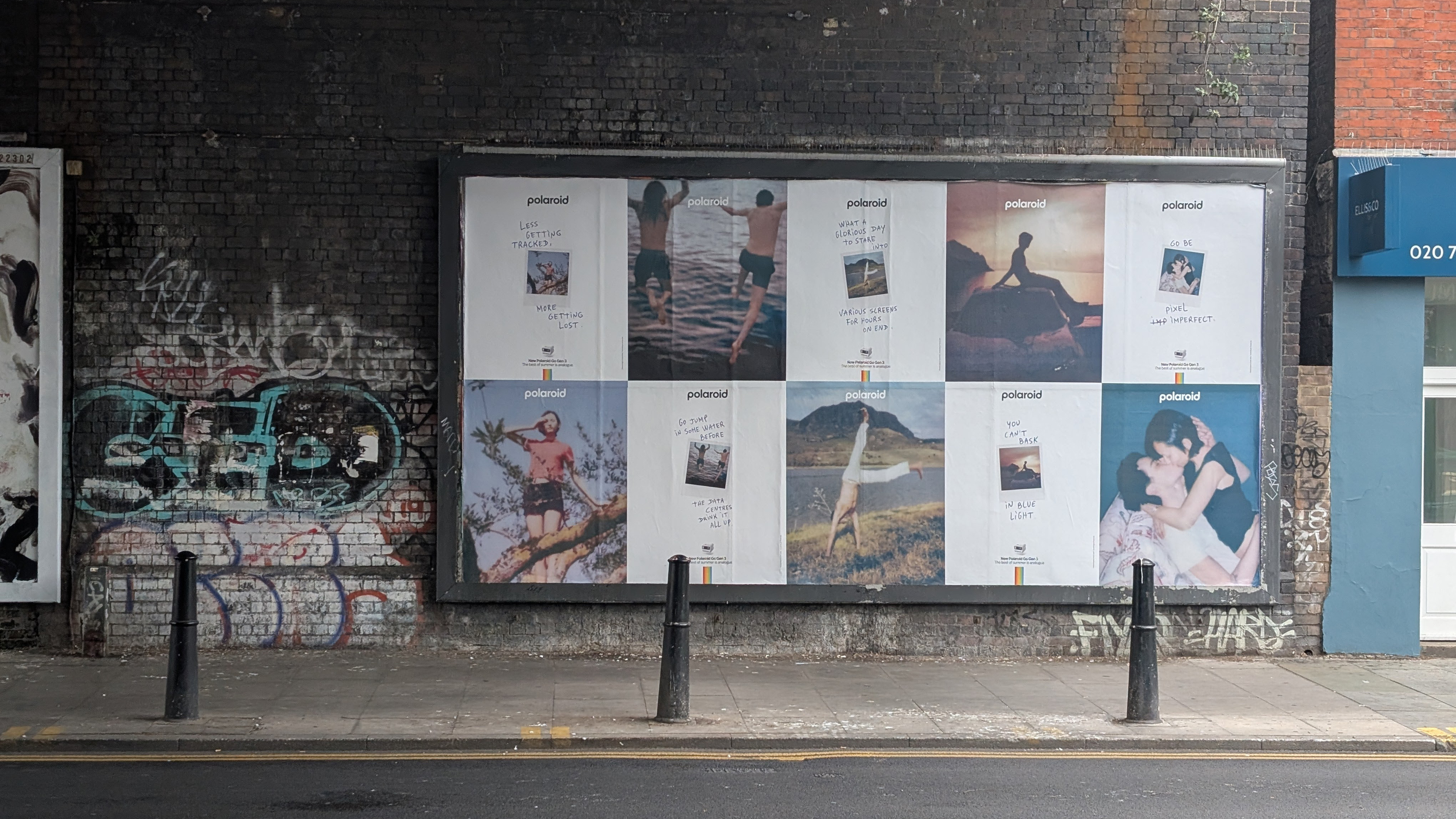 A Polaroid billboard encouraging an analog summer