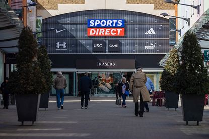 A Sports Direct sign above the entrance to a Frasers Group Plc department store