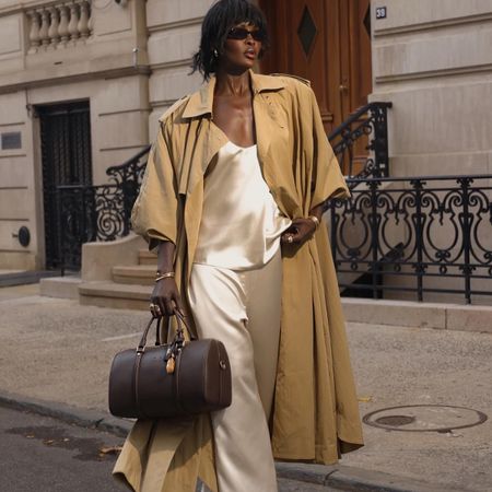 amy lefevre wearing a matching set and trench coat