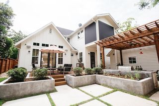 White home with white and gray backyard space