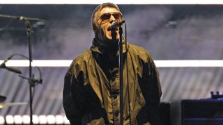 Lead singer of British rock band Oasis Liam Gallagher performs on stage at Soldier Field in Chicago on August 28, 2025, during the band's reunion tour. British rock legends Oasis kicked off the North American leg of their blockbuster reunion tour in Toronto on August 24 as ecstatic Canadian fans flocked to their first chance to see the band since 2008.