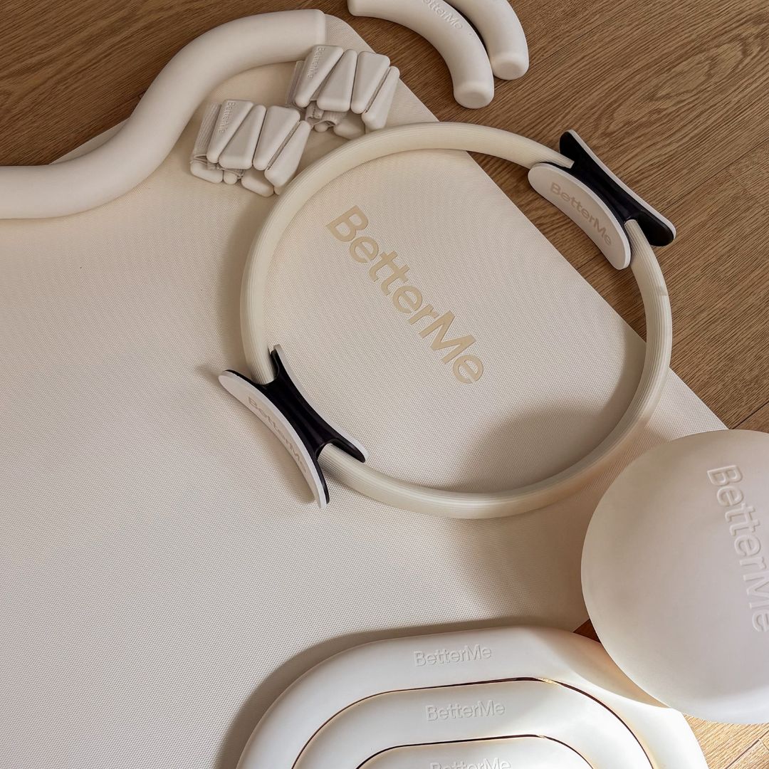 Ivory-colored Pilates equipment on the floor