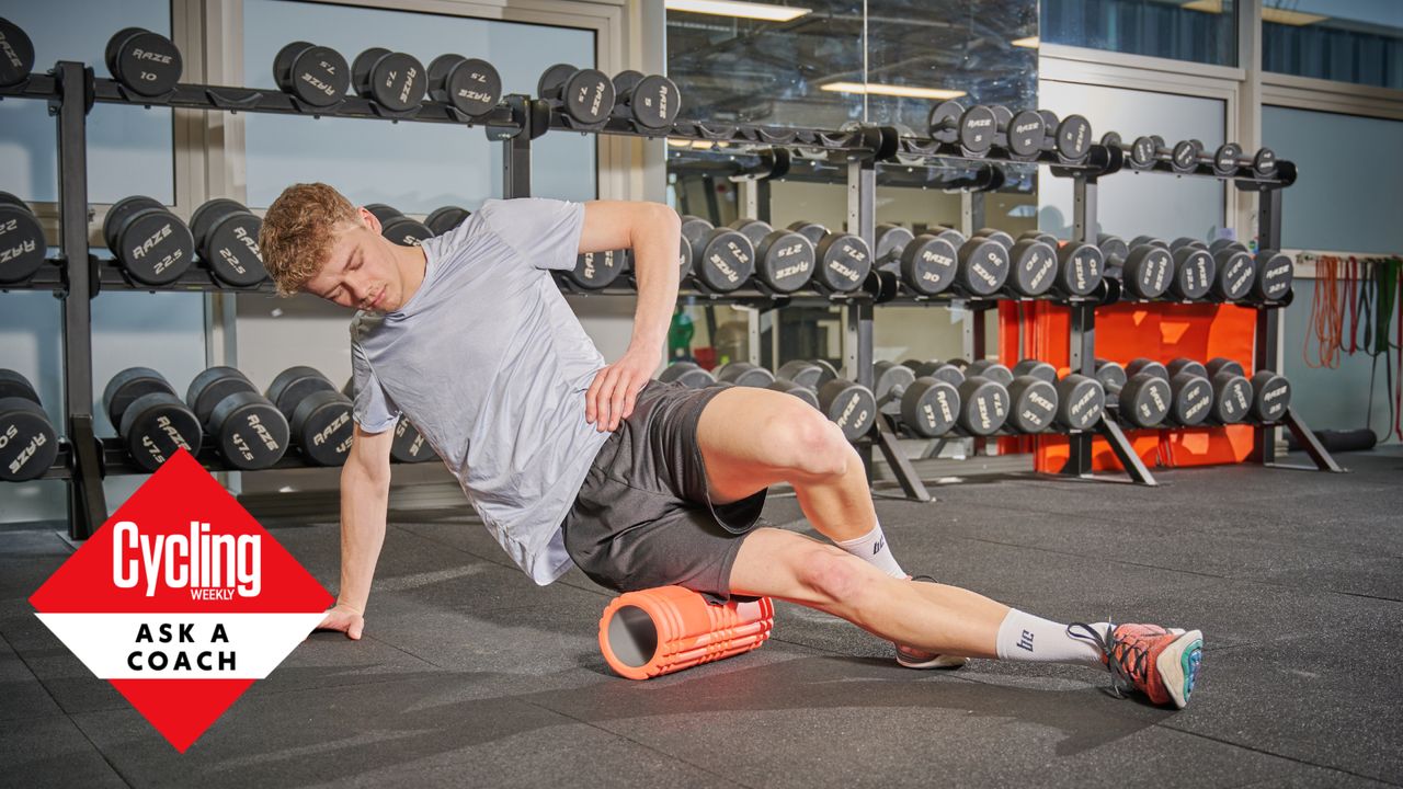 Male cyclist using a foam roller