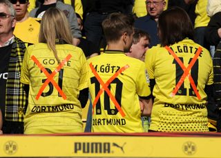 Borussia Dortmund fans show their anger at Mario Gotze after the news that their player had agreed to join Bayern Munich in the summer of 2013.