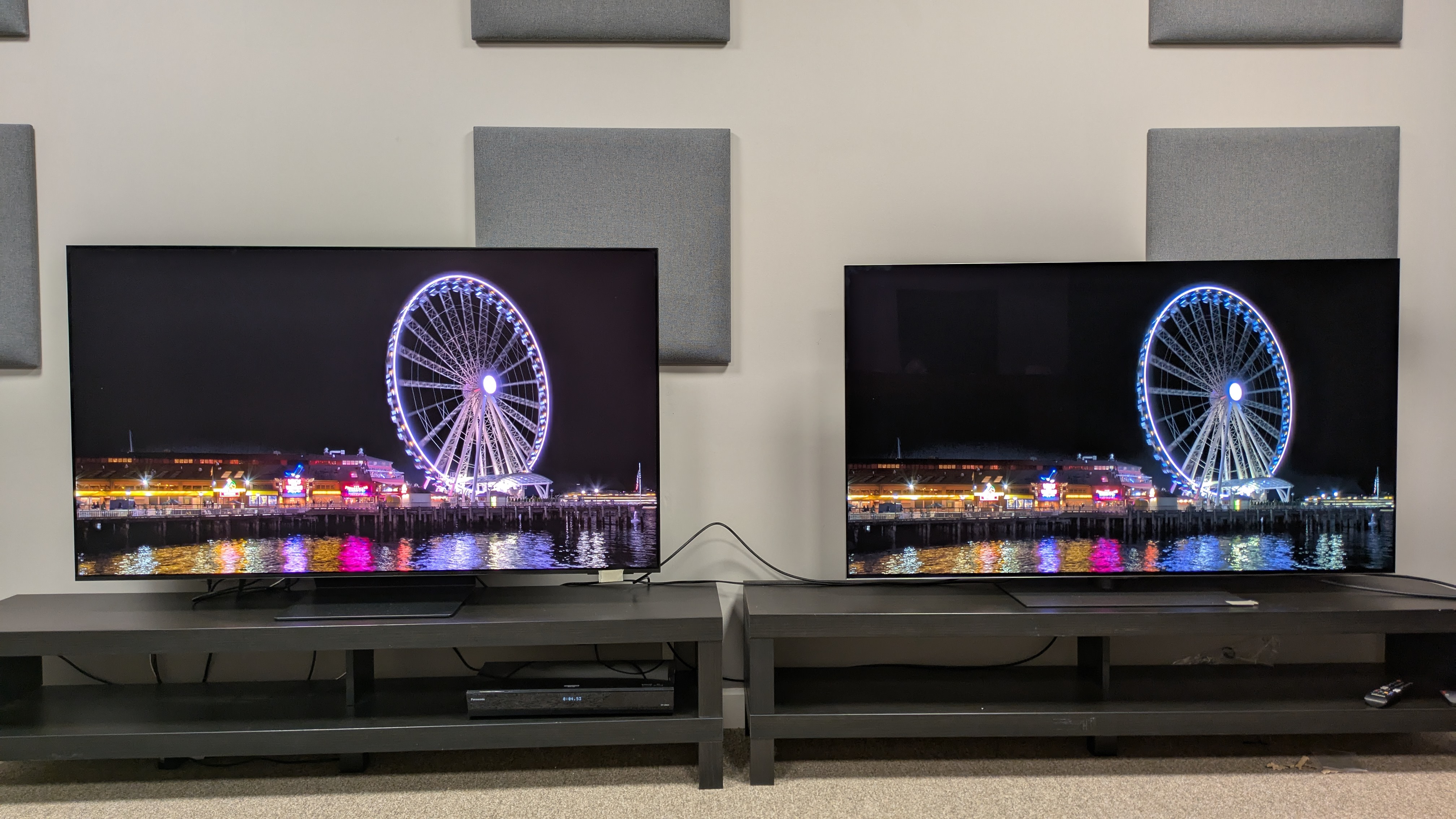Samsung S95F (left) Vs LG G5 (right) showing Ferris wheel at night on screen