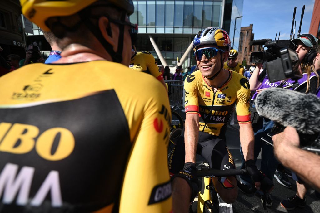 Jumbo-Visma&rsquo;s Wout van Aert celebrates his teammate Olav Kooij&rsquo;s stage victory
