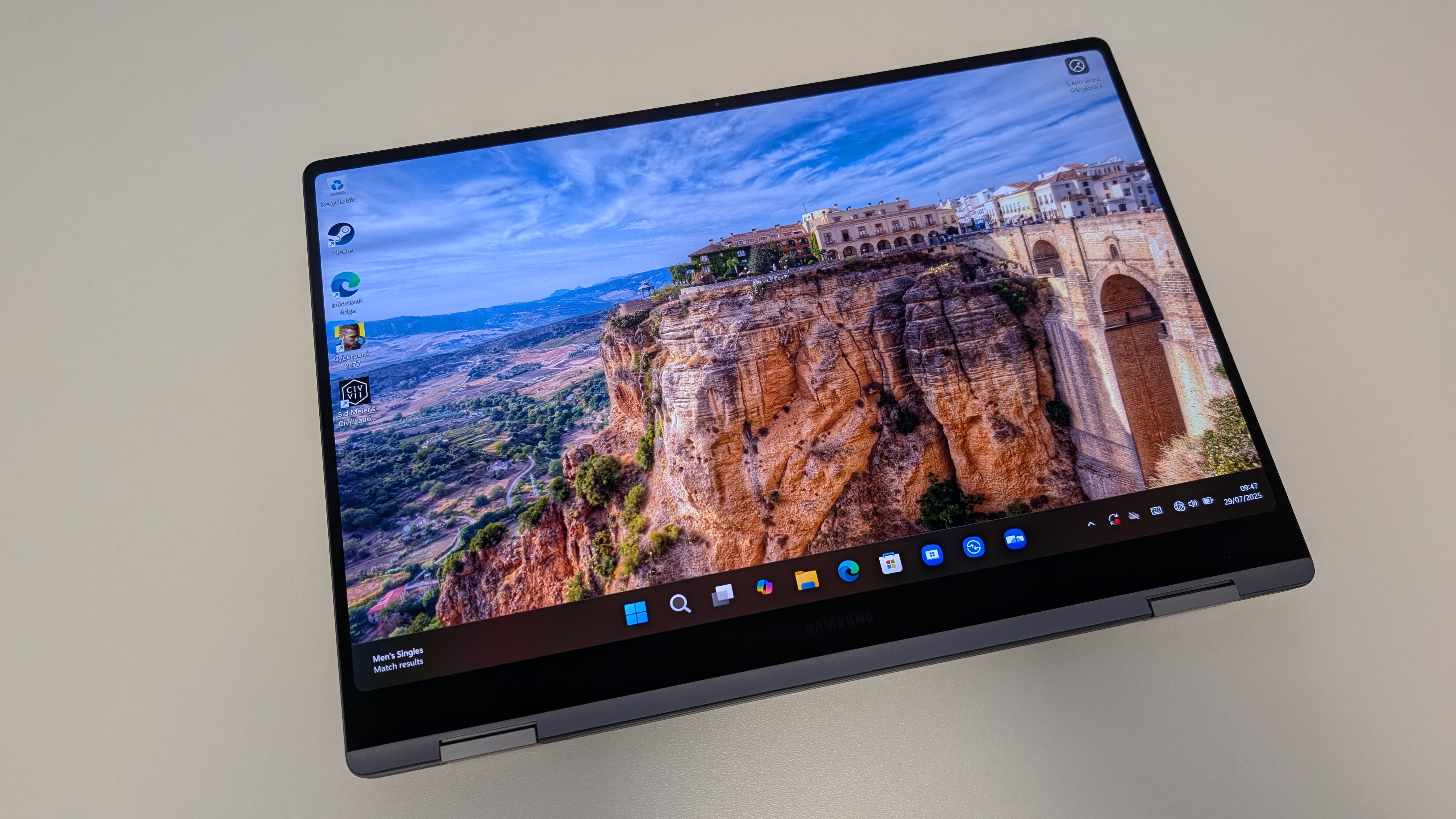 The Samsung Galaxy Book5 Pro 360 photographed on a white desk.