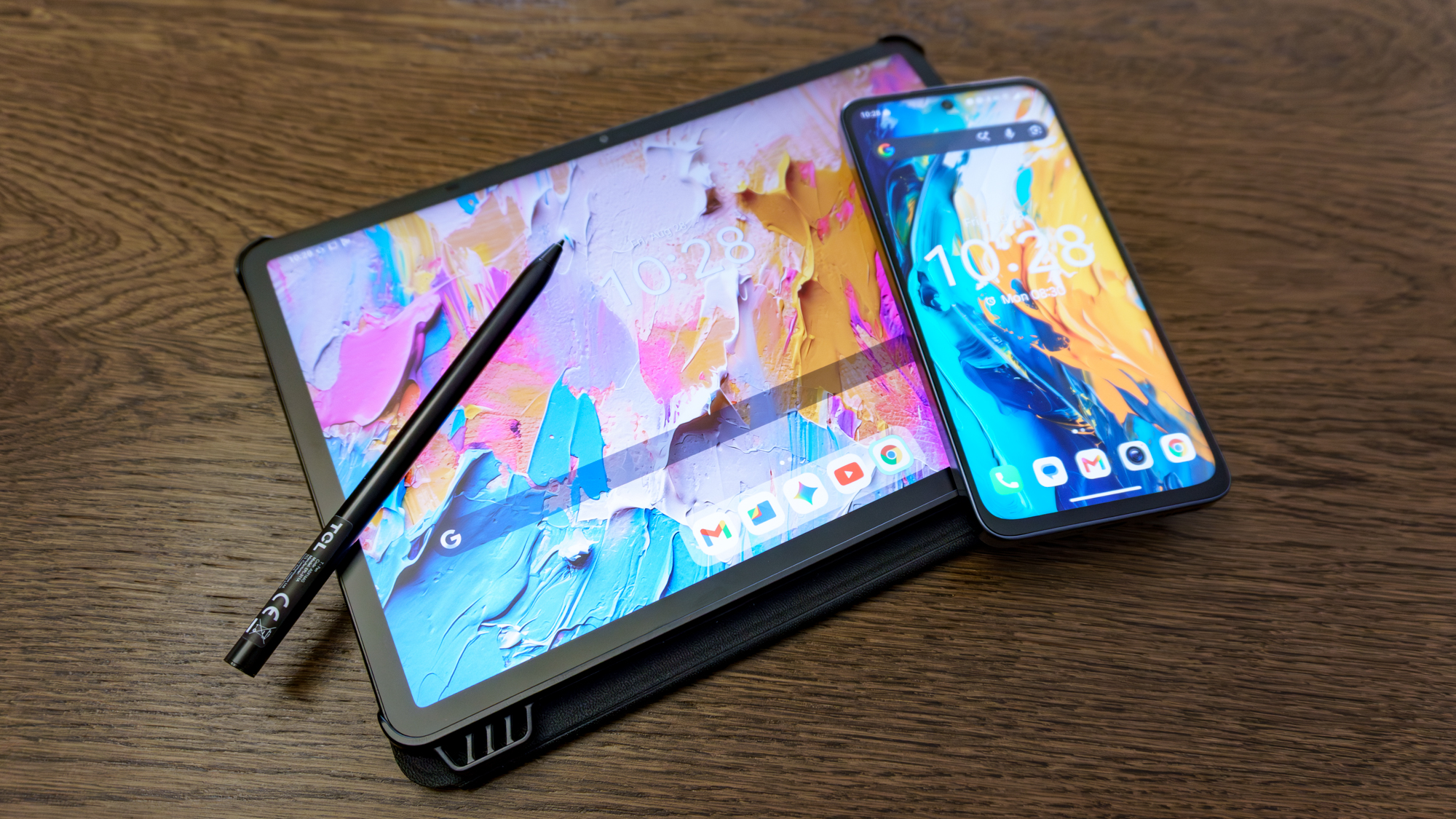 The TCL NXTPAPER 70 Pro phone on top of the TCL NXTPAPER 11 Plus tablet on a table