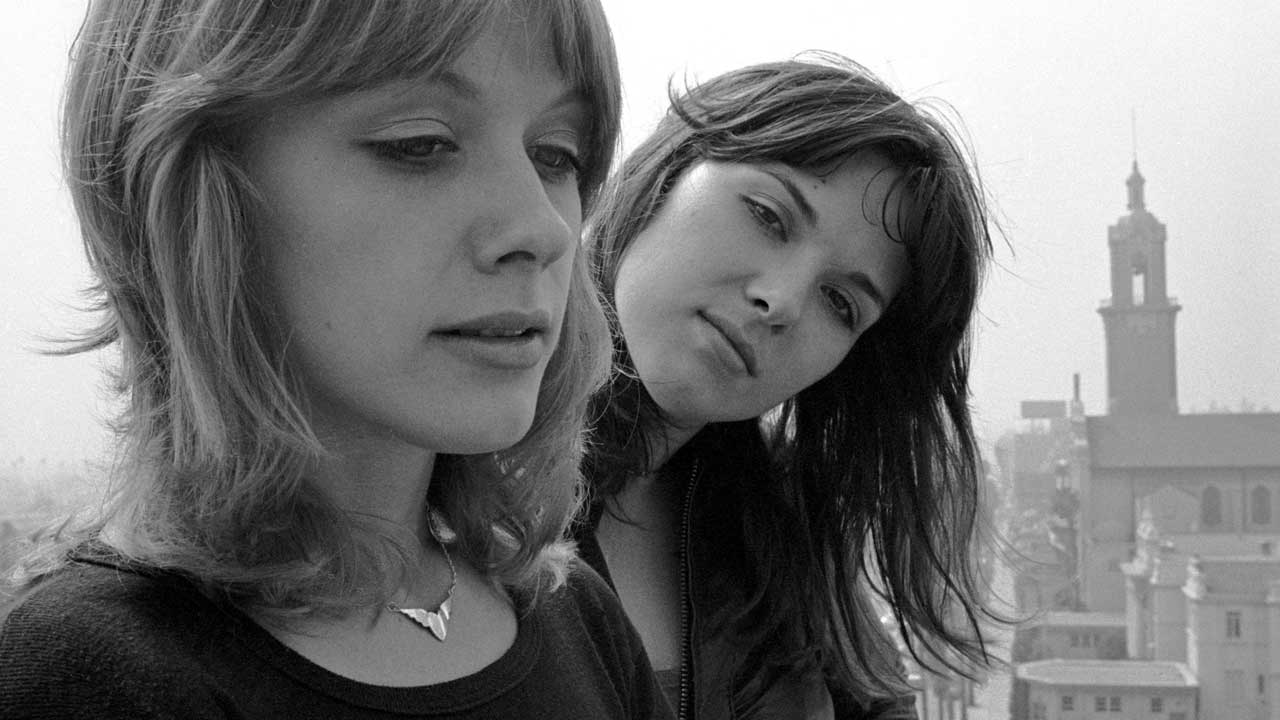 Nancy Wilson and Ann Wilson pose on Hollywood, CA rooftop, September 1976
