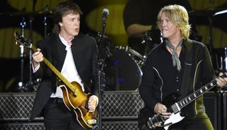 Paul McCartney (left) and Brian Ray perform onstage at the Desert Trip festival in Indio, California on October 8, 2016