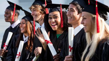 picture of college graduates holding diplomas