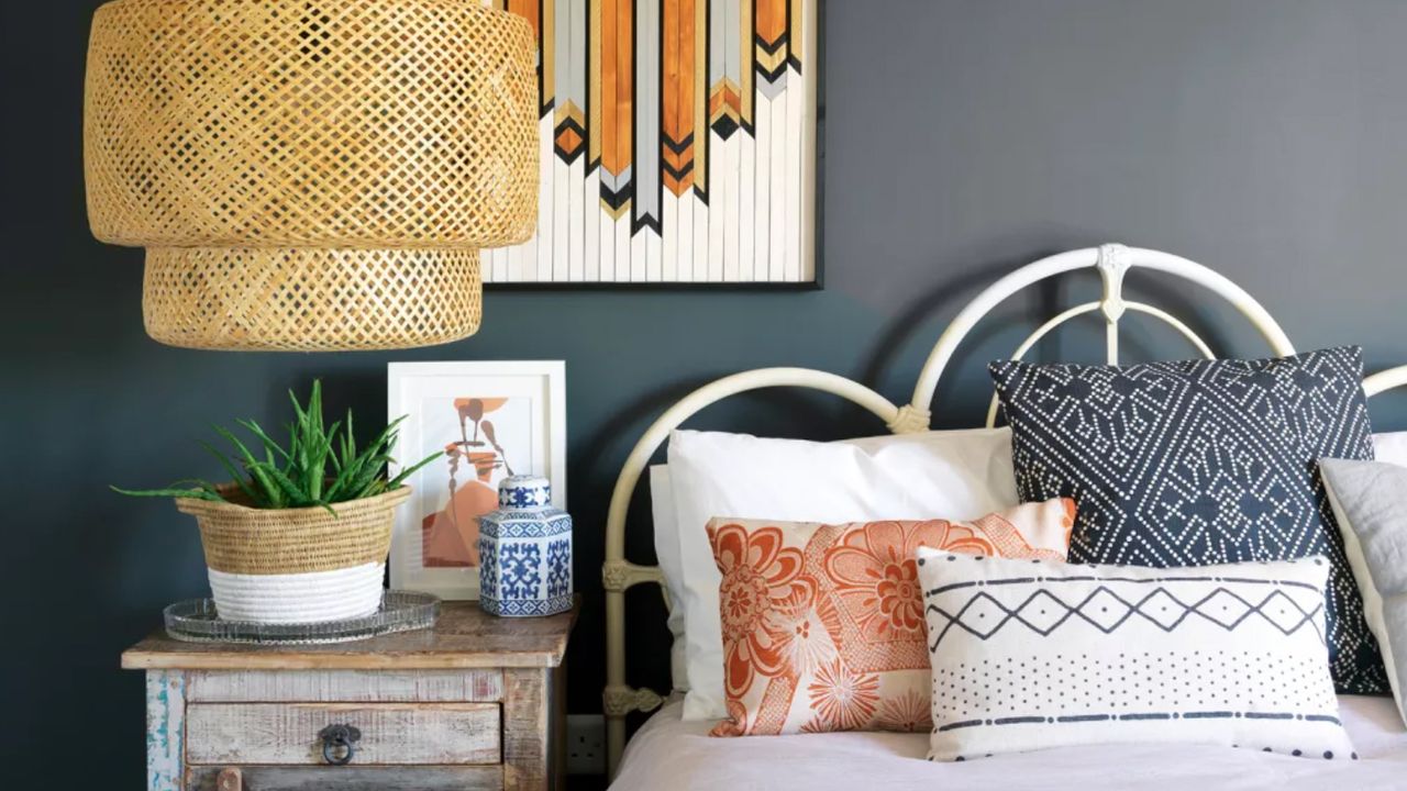 Blue boho bedroom with rattan light