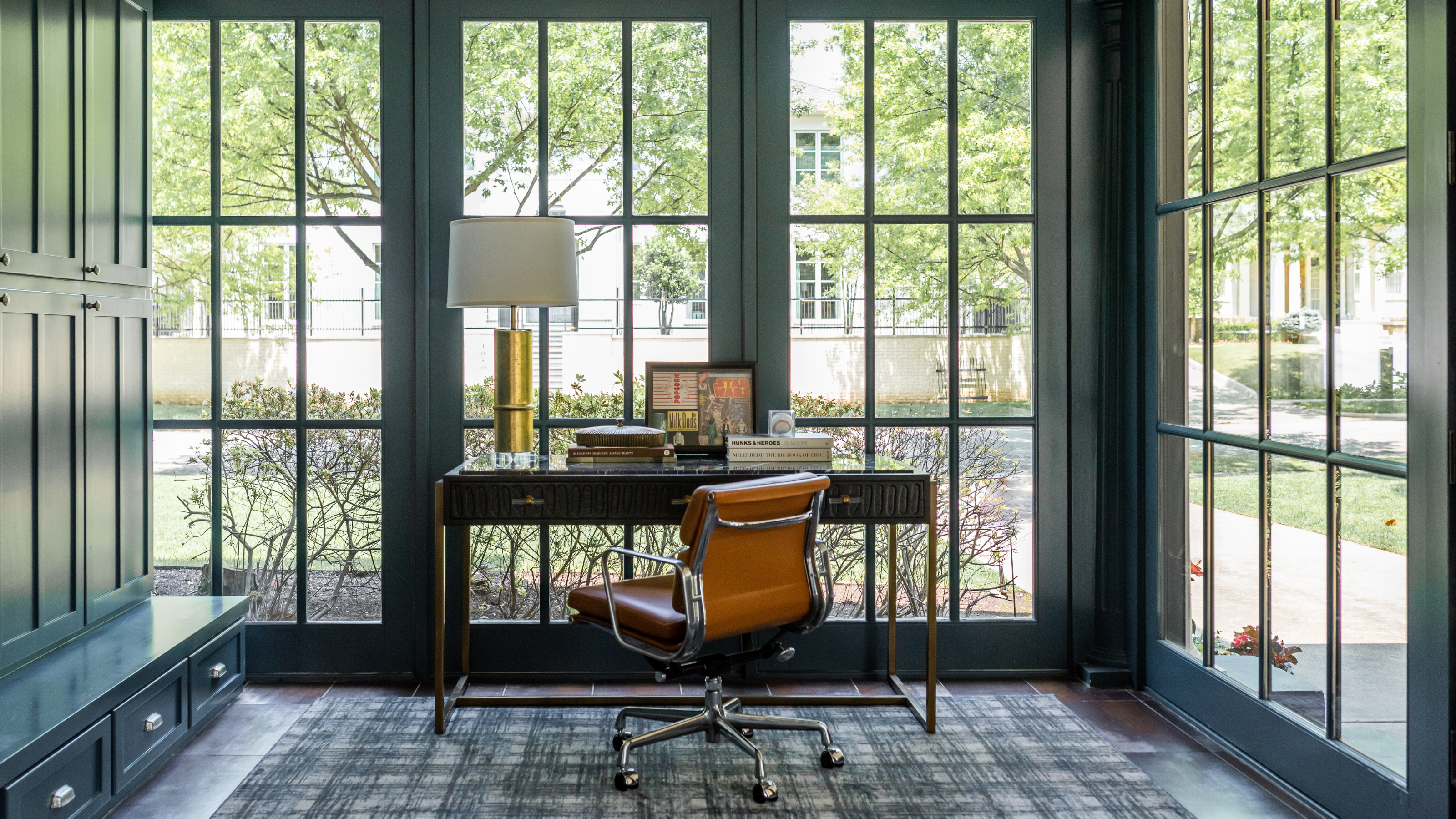 A home office that looks outdoors with a floor to ceiling storage cabinet