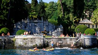 Hotel Guests swimming on the Lake in Lake Como, Italy