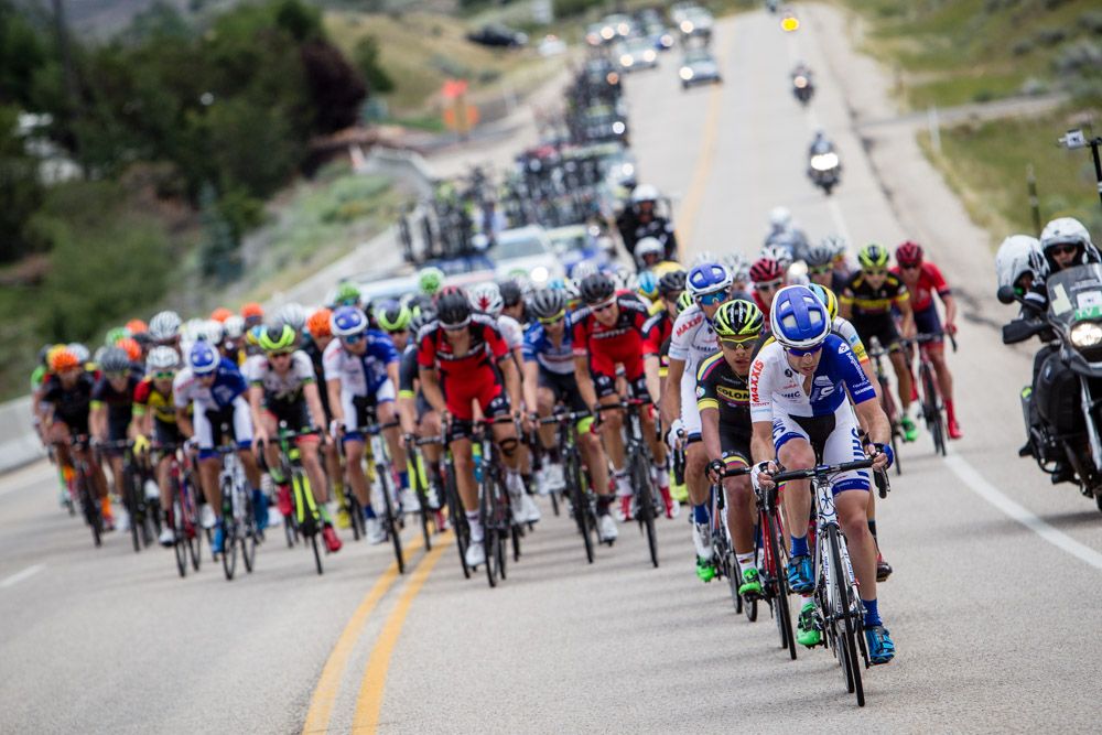 Teams send riders to the front to bring back the break.