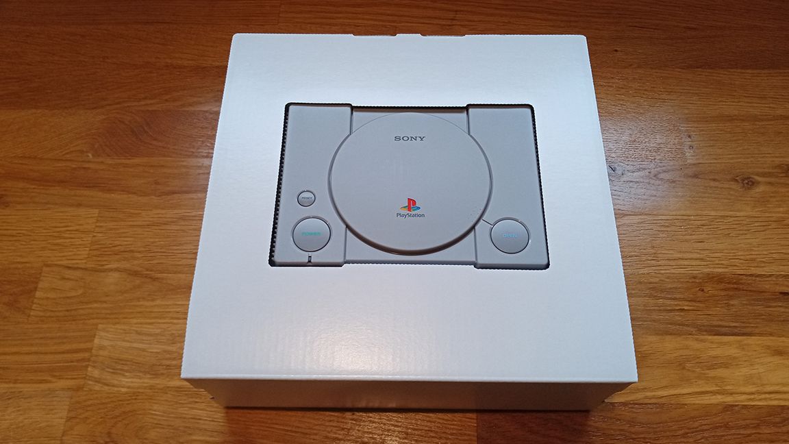 A photo of the PlayStation Classic box on a wooden table, for a review