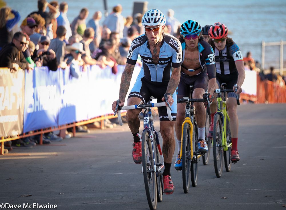 Adam Myerson (Cycle-Smart) leading a group through the start/finish with one lap to go