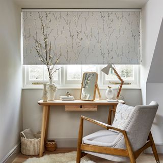 dressing table under window with botanical patterned blind