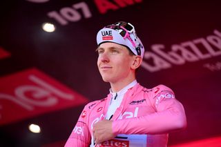 CENTO ITALY MAY 17 Tadej Pogacar of Slovenia and UAE Team Emirates Pink Leader Jersey celebrates at podium during the 107th Giro dItalia 2024 Stage 13 a 179km stage from Riccione to Cento UCIWT on May 17 2024 in Cento Italy Photo by Dario BelingheriGetty Images