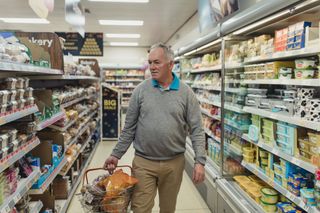A mature man shopping in a supermarket