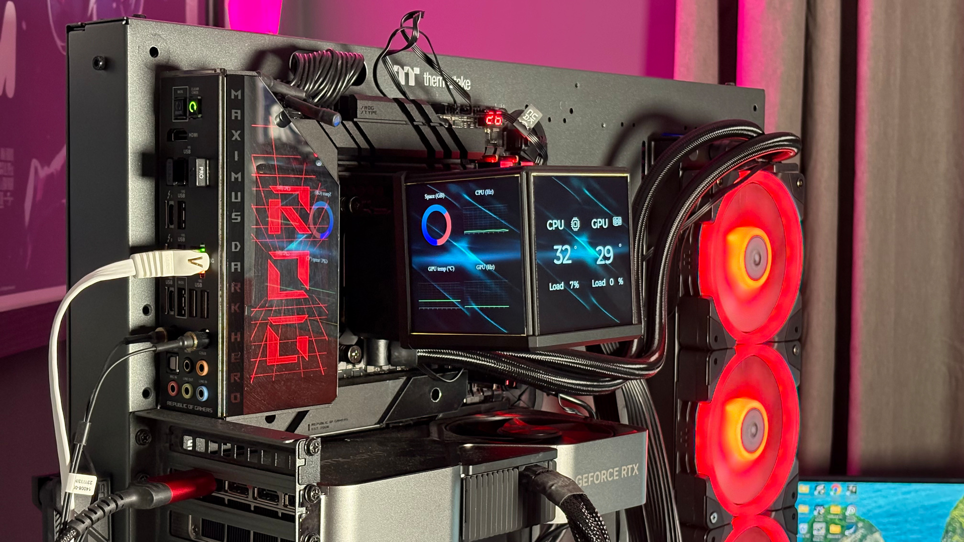 The Thermaltake Minecube 360 Ultra ARGB Sync set up on an open test bench.