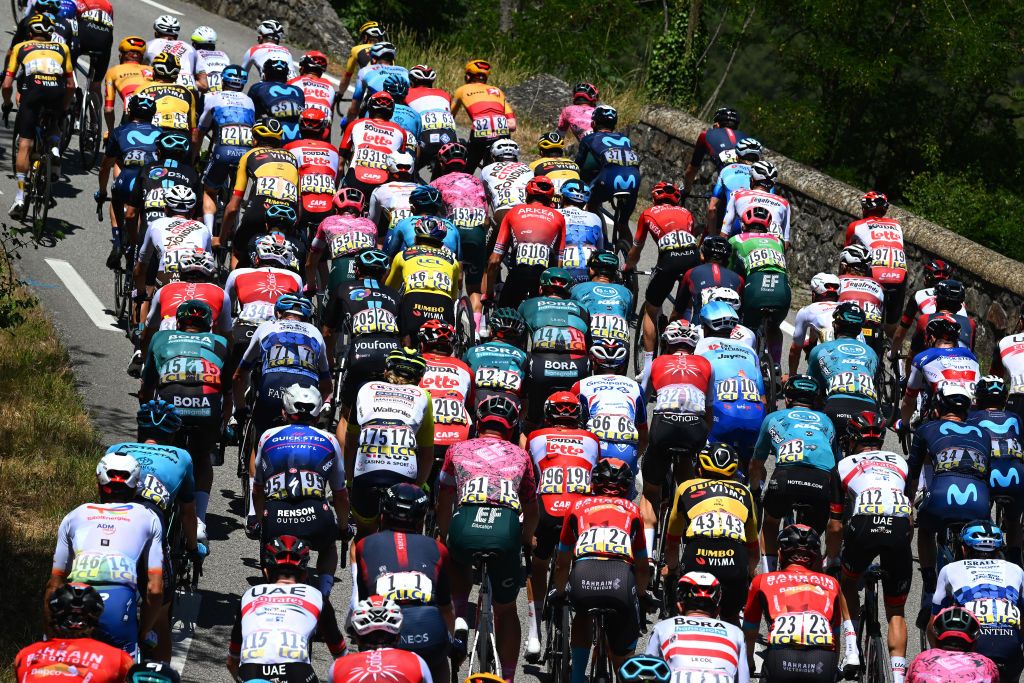 BRIVESCHARENSAC FRANCE JUNE 06 Detailed view of Wout Van Aert of Belgium and Team Jumbo Visma Yellow Leader Jersey Sean Quinn of United States and Team EF Education Easypost Green Points Jersey and the peloton competing during the 74th Criterium du Dauphine 2022 Stage 2 a 1698km stage from SaintPray to BrivesCharensac WorldTour Dauphin on June 06 2022 in BrivesCharensac France Photo by Dario BelingheriGetty Images