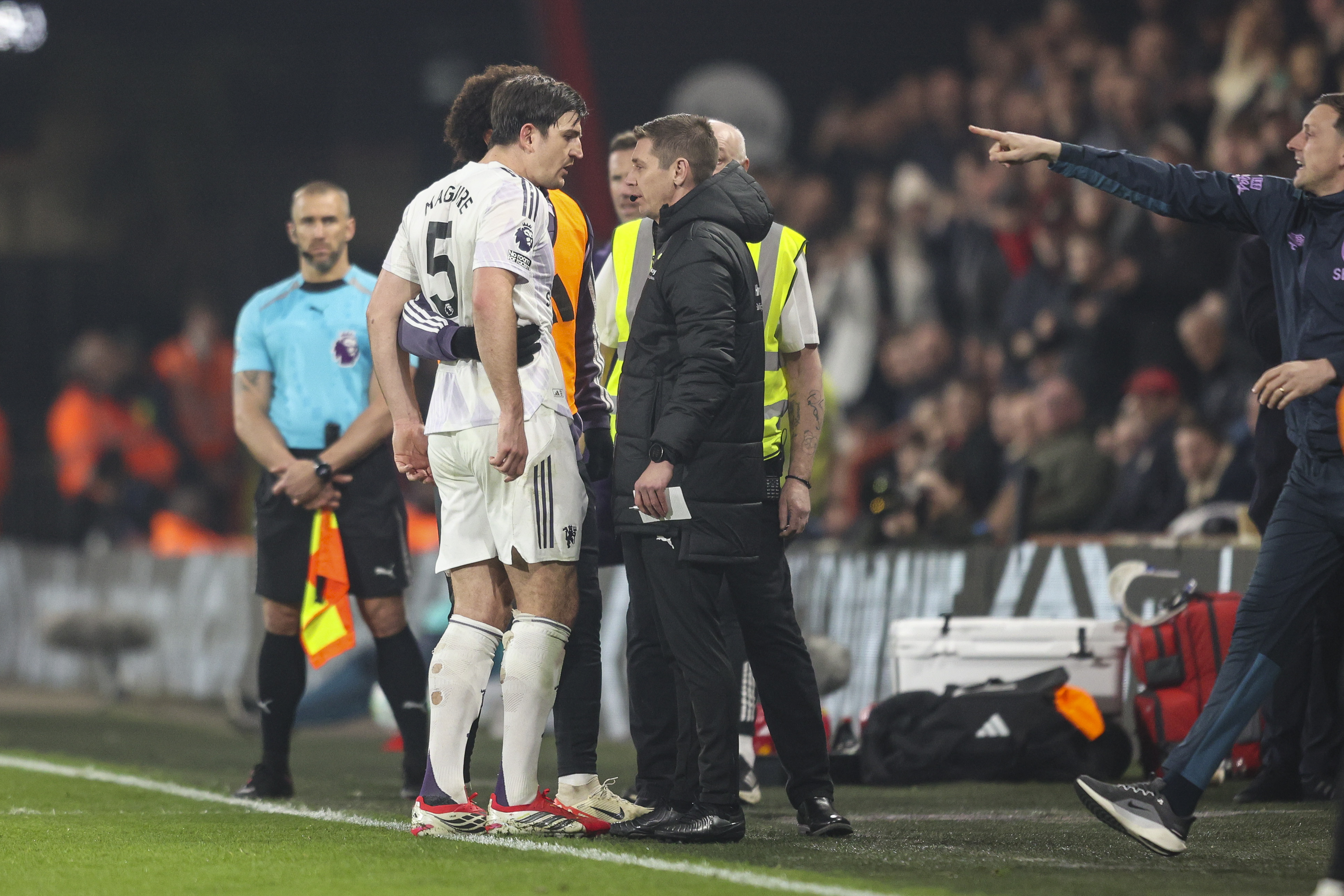 Harry Maguire confronts fourth official Matt Donohue after he was sent off at Bournemouth