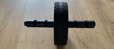 GymShark ab roller on wooden floor