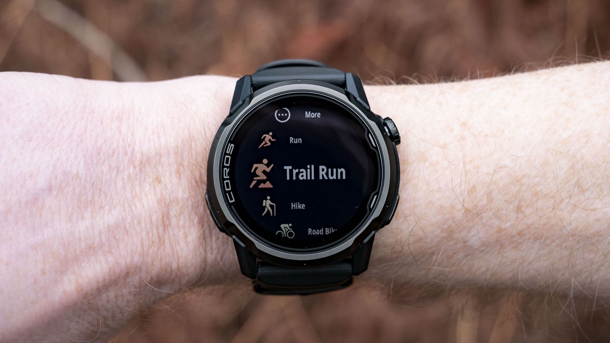 Coros Apex 4 running watch on athlete's wrist