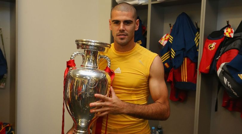 Víctor Valdés poses with the Euro 2012 trophy after Spain&#039;s win over Italy in the final in July 2012.