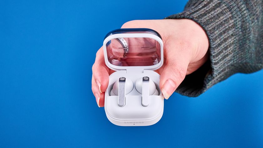 the samsung galaxy buds 4 pro in white photographed against the blue tom's guide background