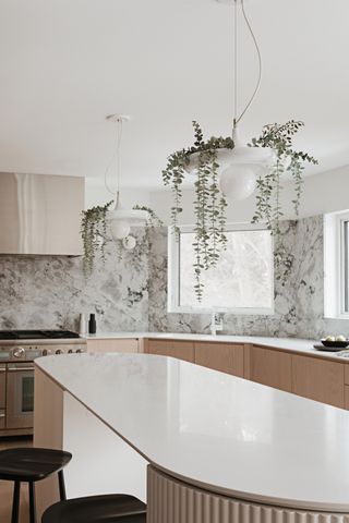 A white kitchen with clear countertops