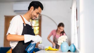 Man and woman cleaning