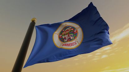 Minnesota state flag with yellow sky background for Minnesota state tax guide