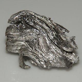 A small chunk of ultrapure holmium, 1.5 by 2.5 cm, weighs 17 grams.