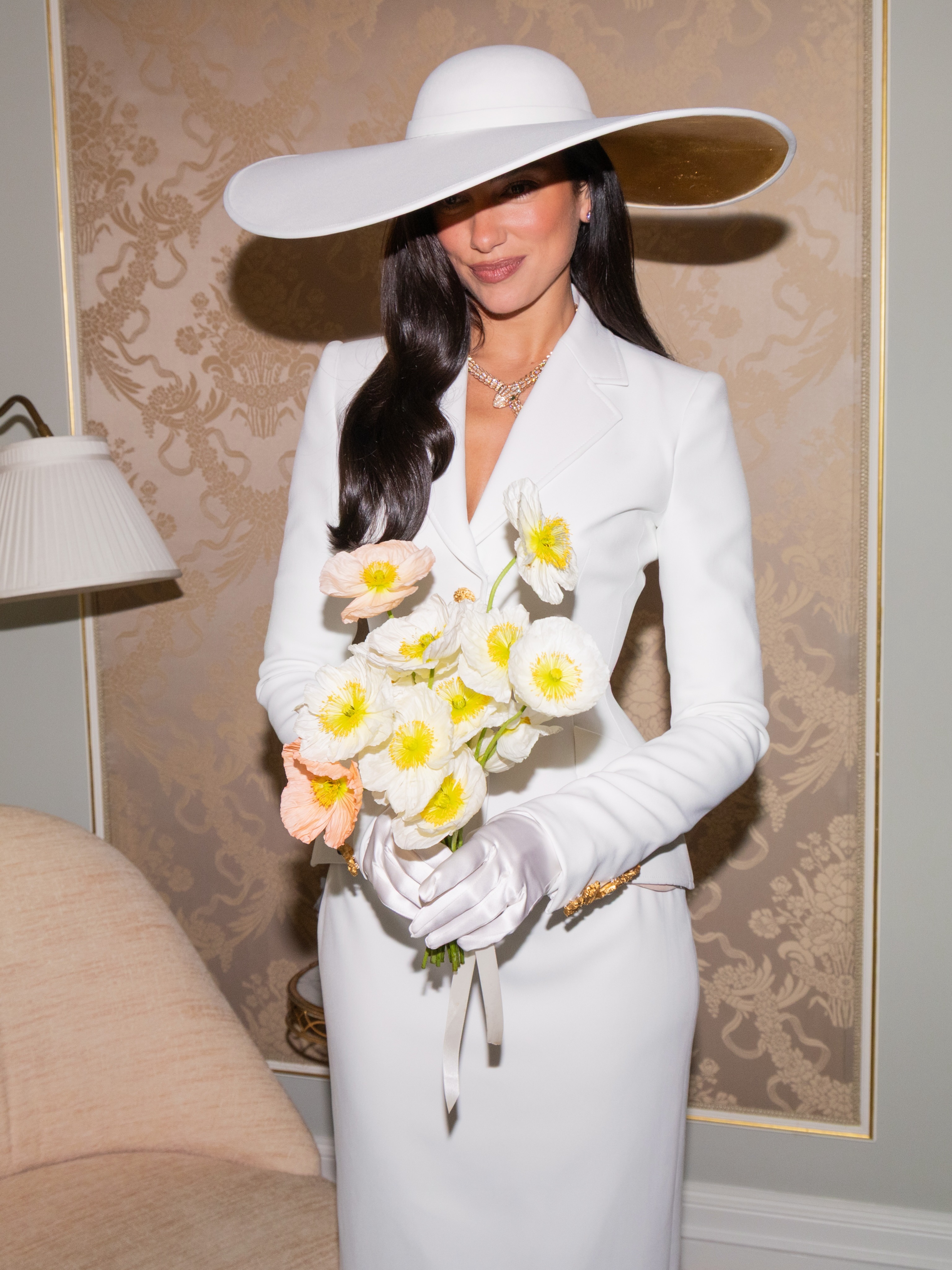 Woman wearing white elopement outfit.