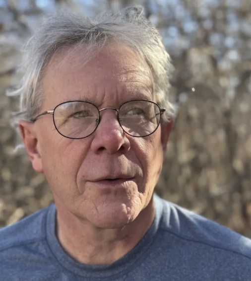 man wearing blue t-shirt