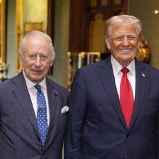 King Charles and Donald Trump standing next to each other and smiling
