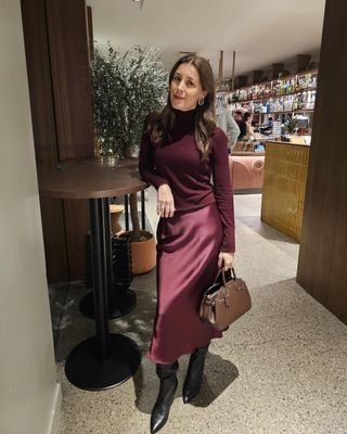 Fashion editor Judith Jones in burgundy silk skirt and sweater