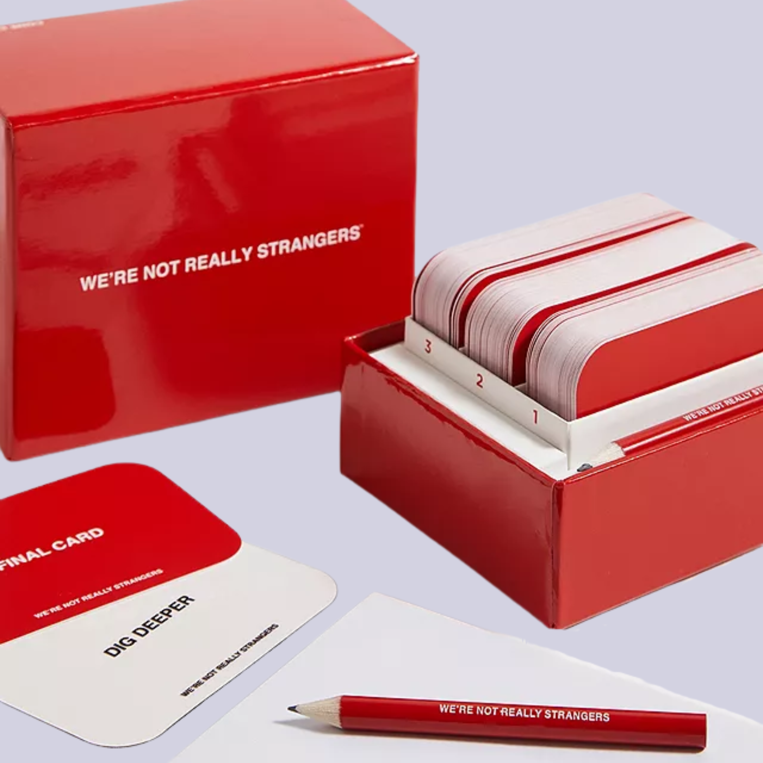 A set of red game cards and a notepad with a red pencil