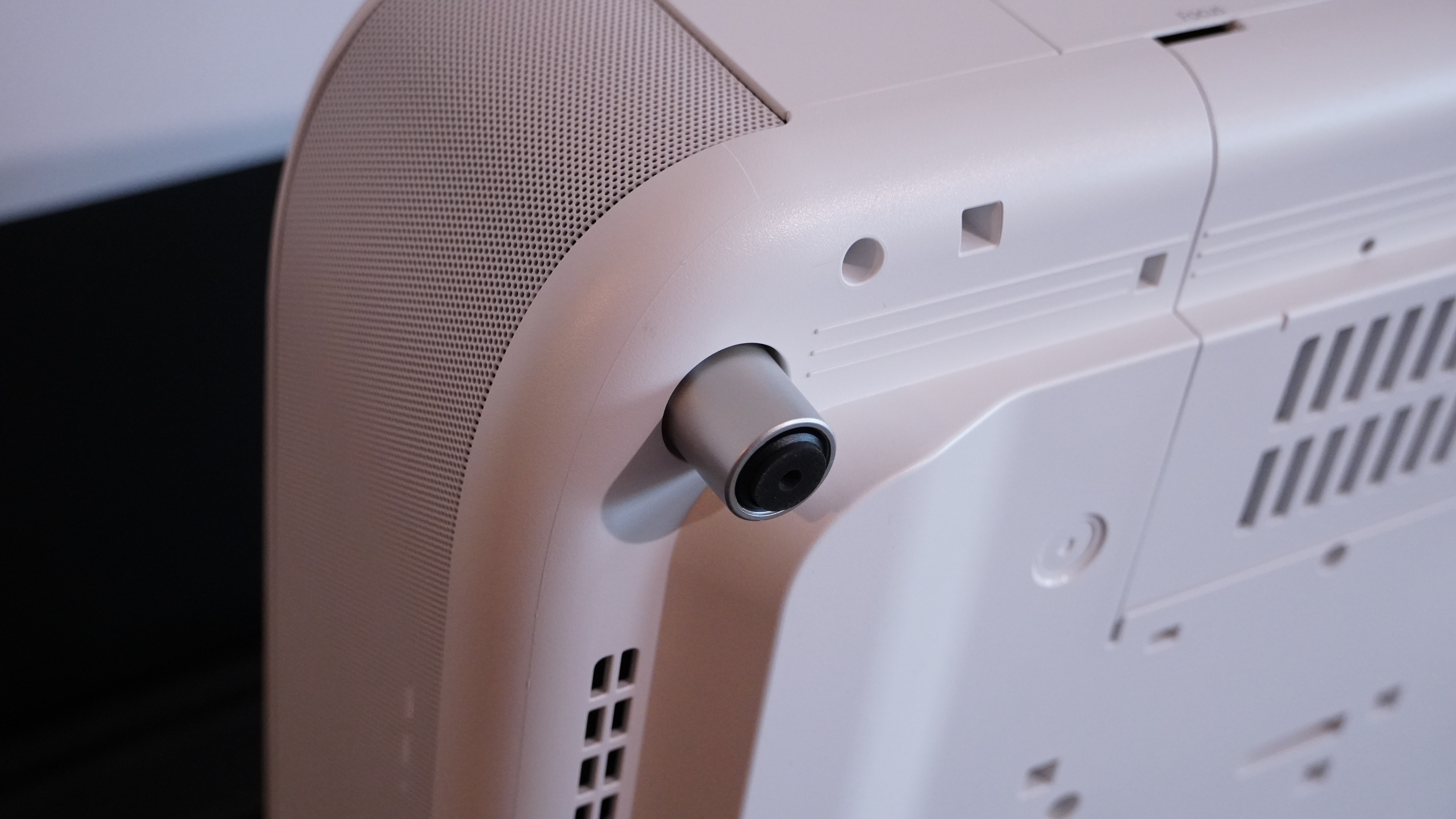 A close up of the Epson LifeStudio Grand Projector's small silver legs
