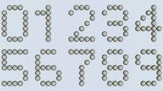 Numbers 0 to 9 written in laid out golf balls