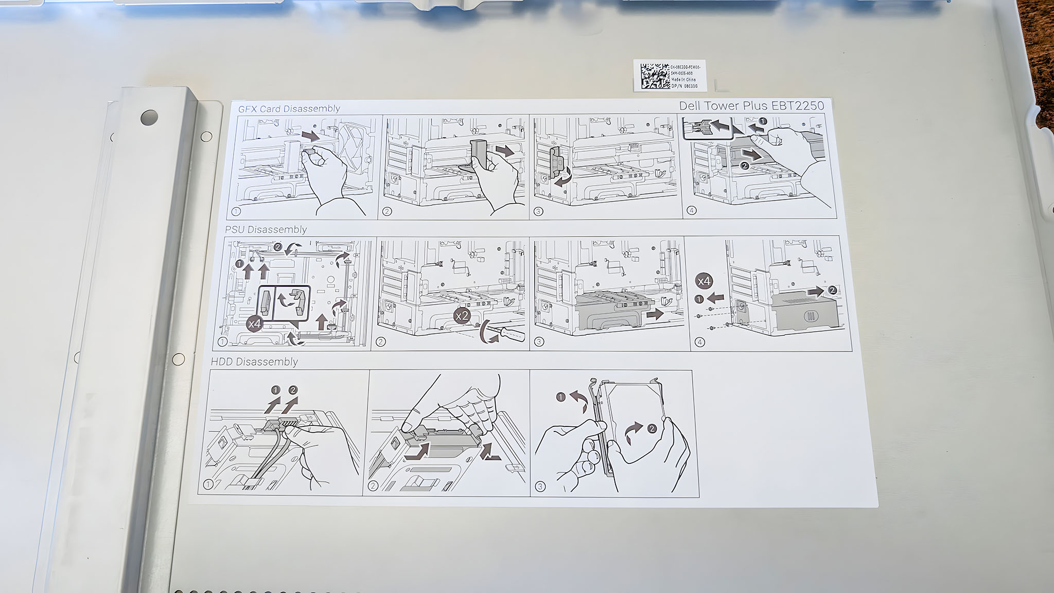 Illustrated instructions on the inside of the Dell Tower Plus EBT2250's side panel explaining how to open an disconnect various parts.