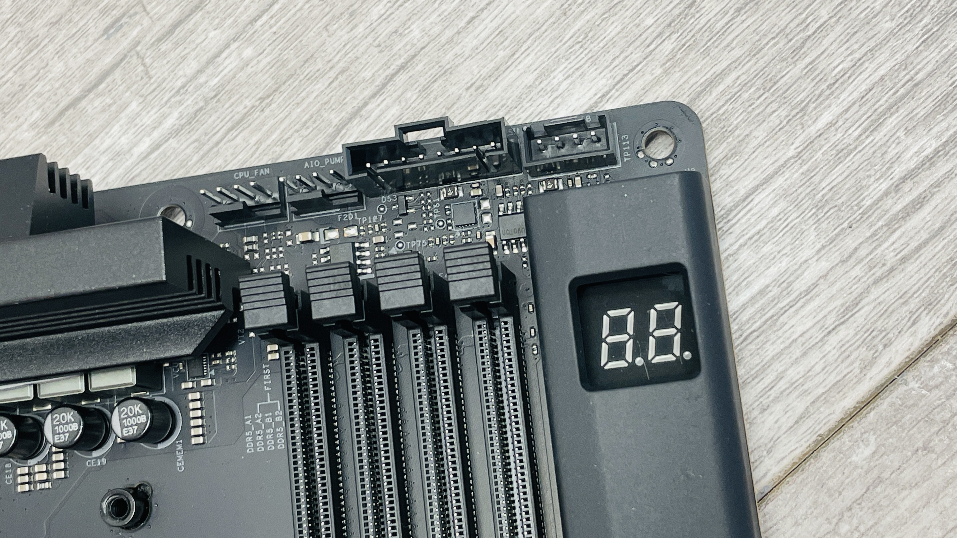 An NZXT N9 X870E motherboard in black with the port covers removed.