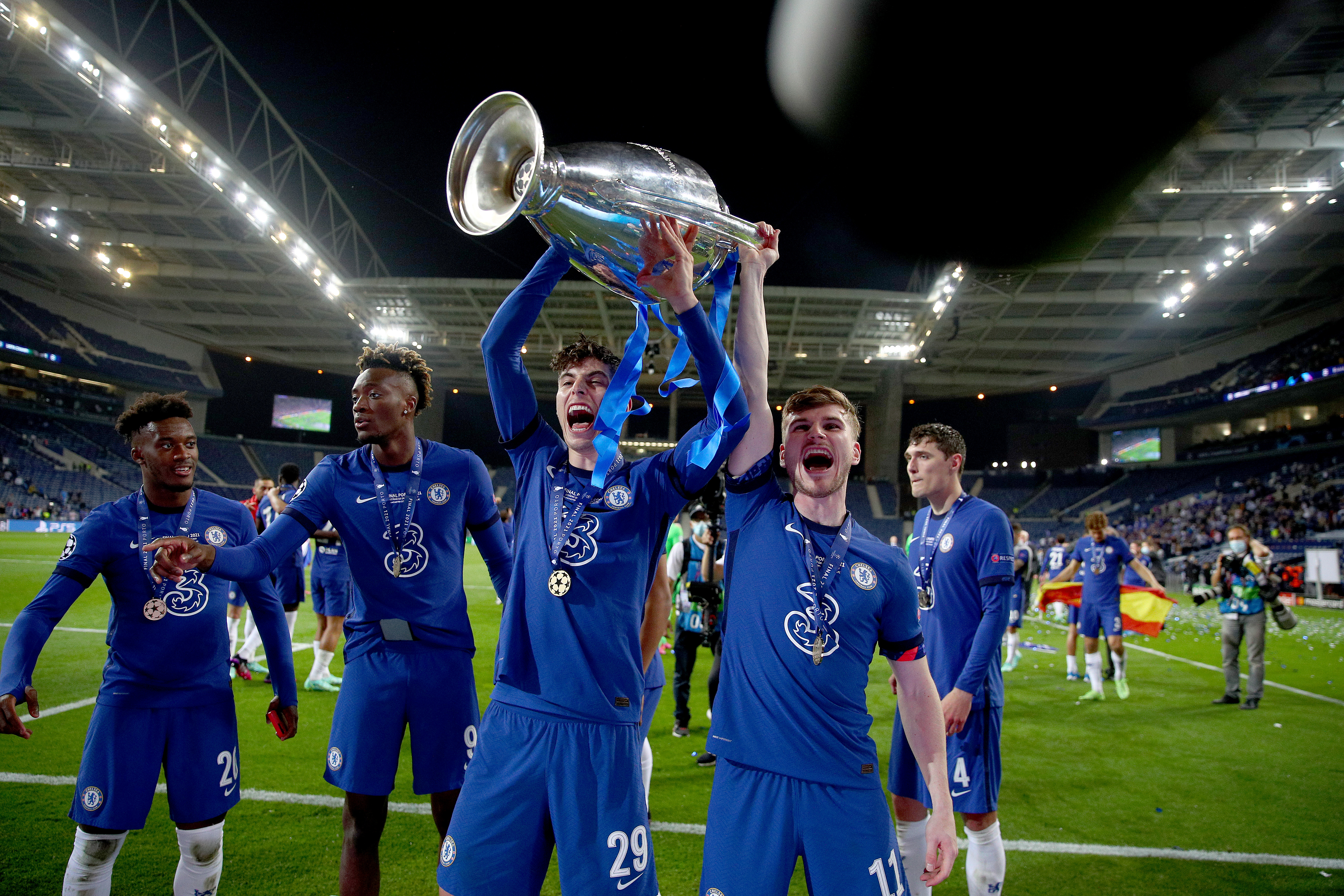 Chelsea players celebrate with the Champions League trophy after victory over Manchester City in the 2021 final in Porto.