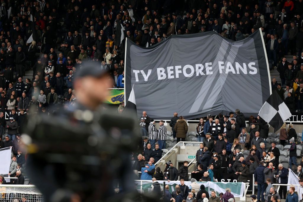 Newcastle United fans hold up a banner reading &#039;TV BEFORE FANS&#039; prior to the Premier League match between Newcastle United and Luton Town at St. James Park on February 03, 2024 in Newcastle upon Tyne, England. 